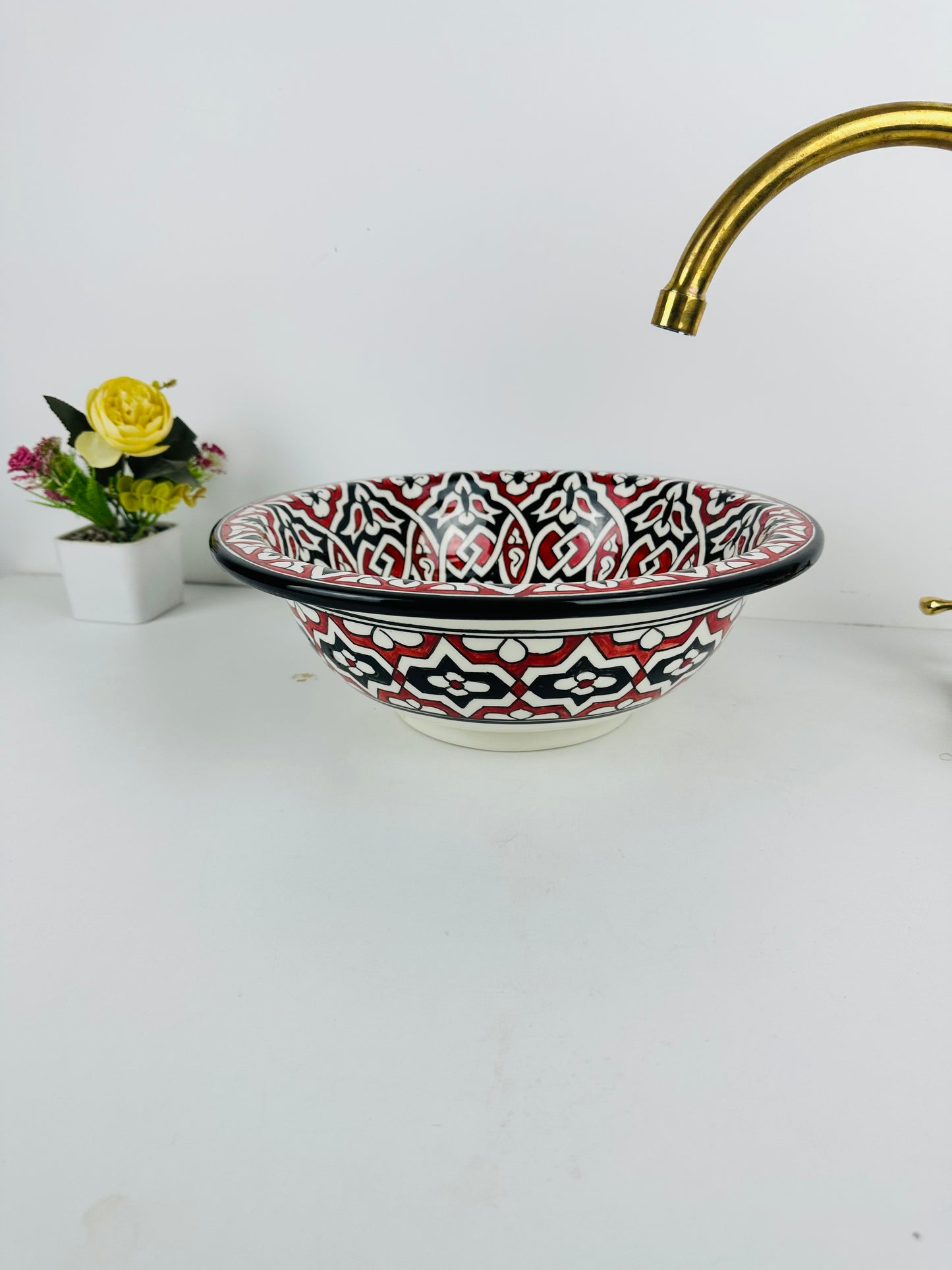 Timeless Contrast: Handcrafted Ceramic Sink with Classic Black and Red Accents
