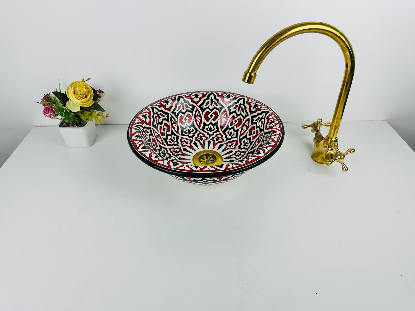 Timeless Contrast: Handcrafted Ceramic Sink with Classic Black and Red Accents