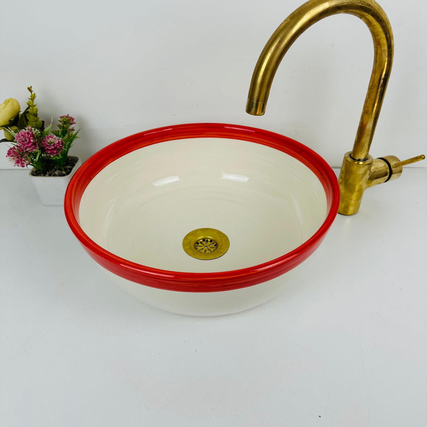 Round Elegance: Handcrafted Ceramic Sink with Red Top Finish