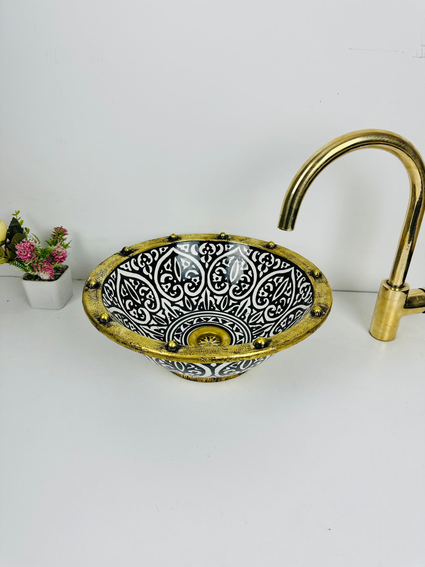 Inkwell Creations: Handcrafted Ceramic Sink with artisanal Black Shapes and brass touch