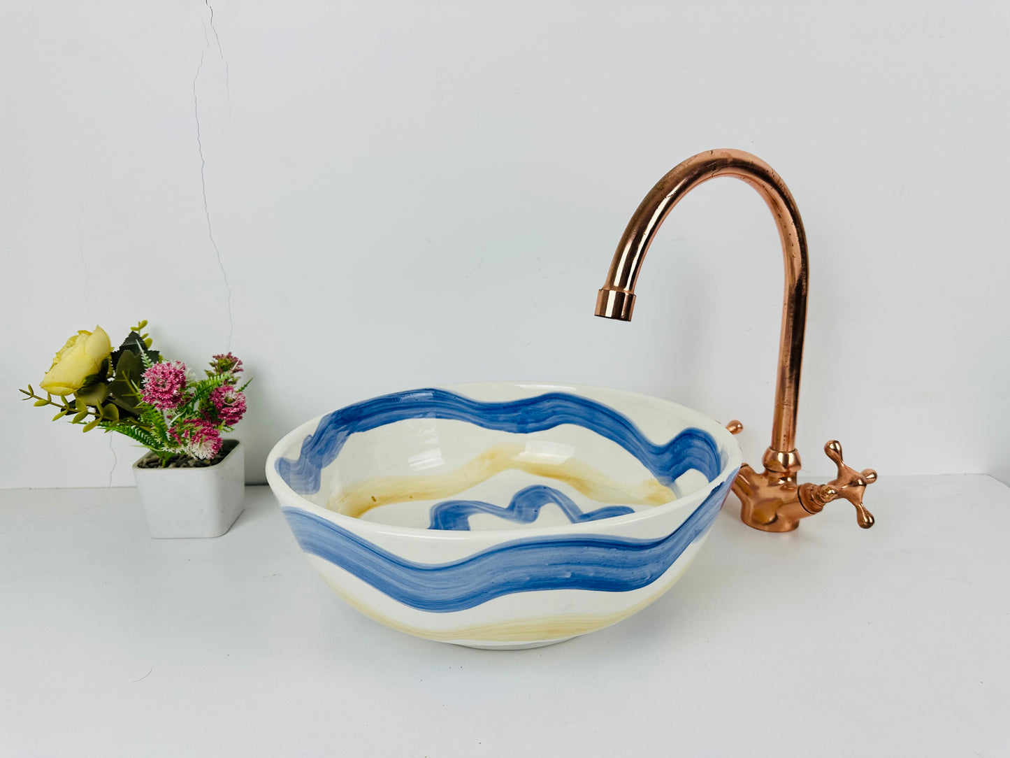 Sunset Seas: Modern Handcrafted Ceramic Sink with Blue and Yellow Wave Motifs