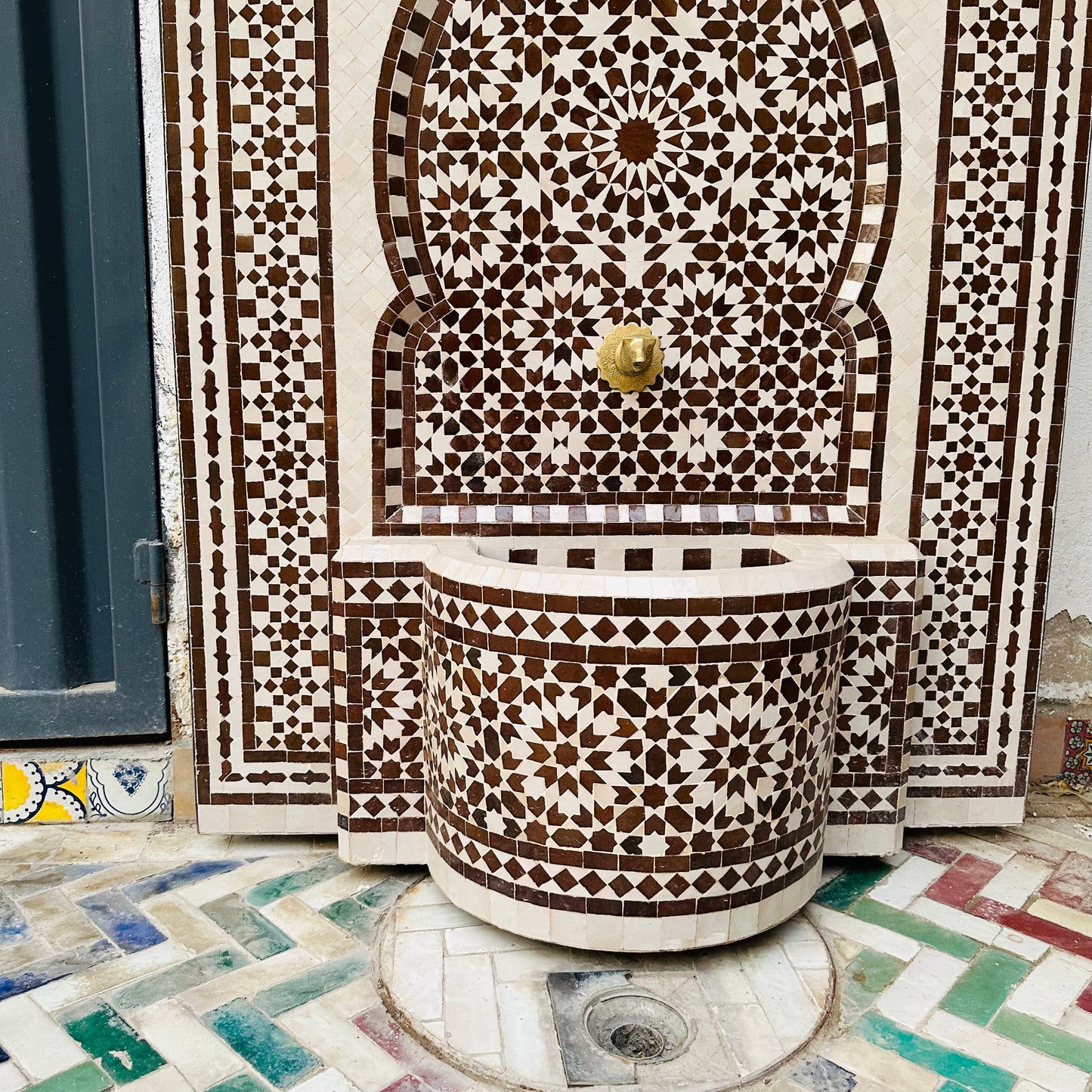 elegant Moroccan Zellige fountain in earthy brown and cream tones