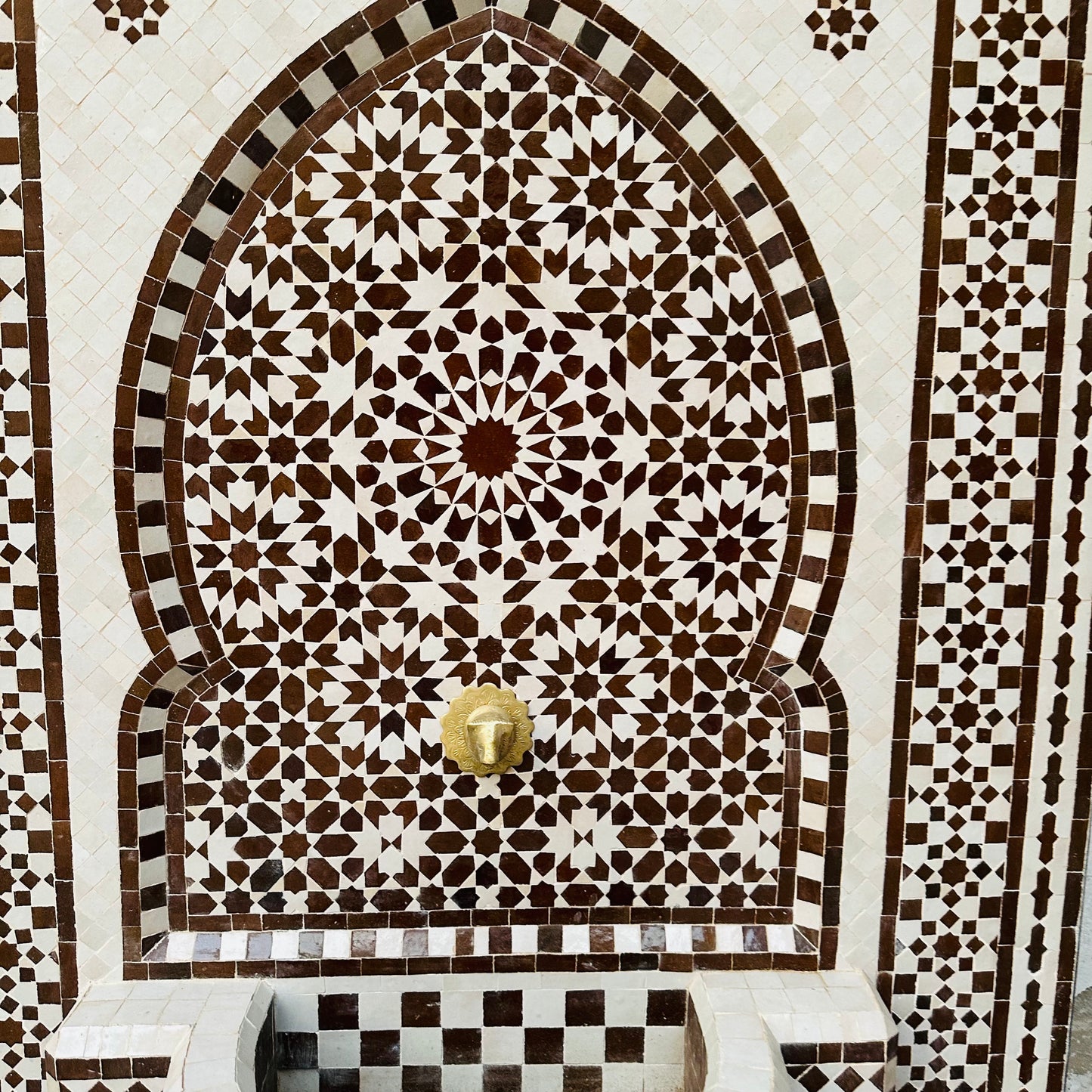 elegant Moroccan Zellige fountain in earthy brown and cream tones