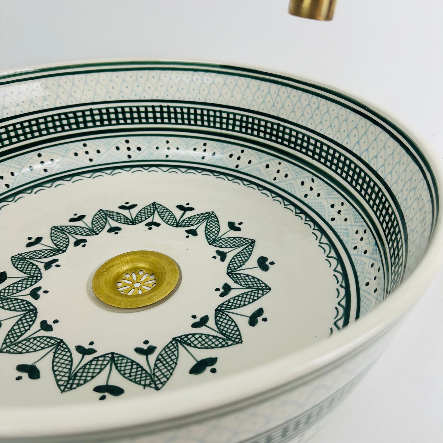Shades of Green: Handcrafted Ceramic Sink with Varied Green Tones