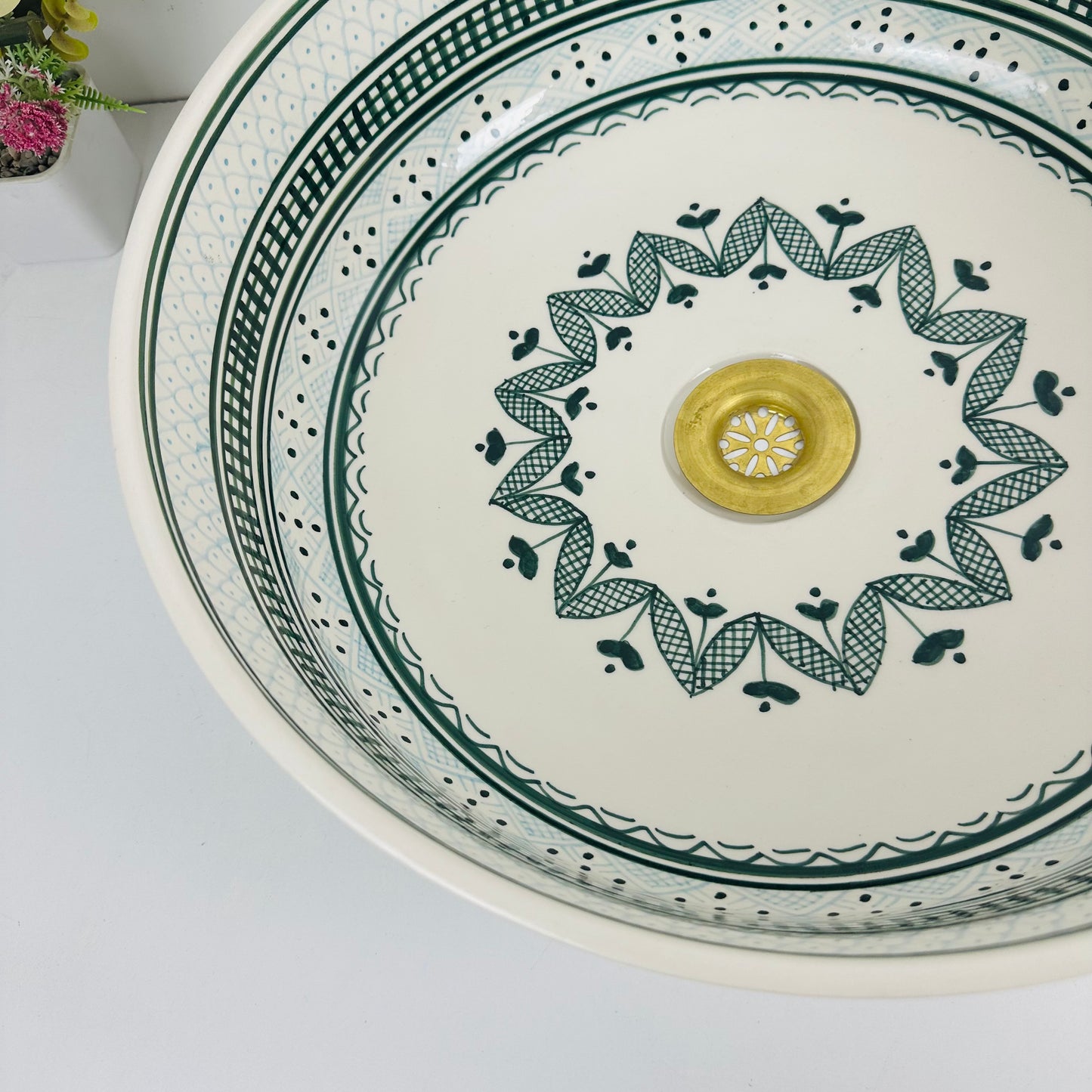 Shades of Green: Handcrafted Ceramic Sink with Varied Green Tones