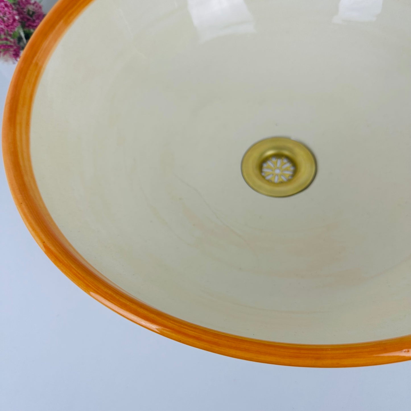 Round Elegance: Handcrafted Ceramic Sink with Orange Top Finish