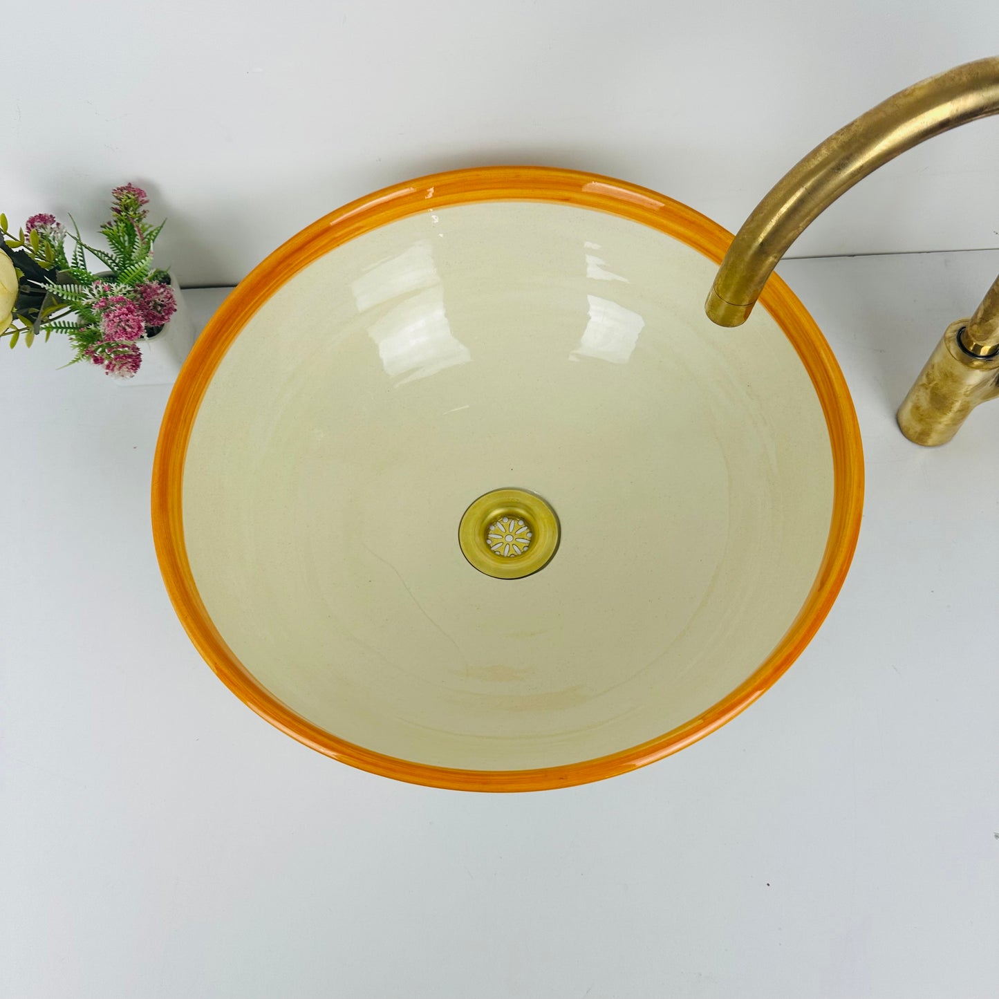 Round Elegance: Handcrafted Ceramic Sink with Orange Top Finish