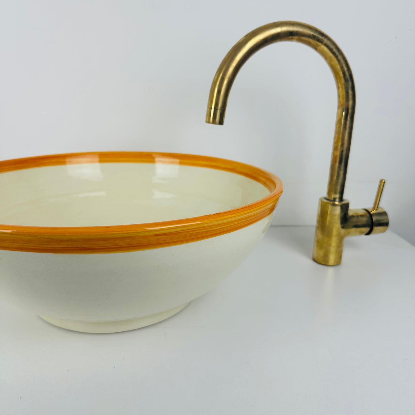 Round Elegance: Handcrafted Ceramic Sink with Orange Top Finish