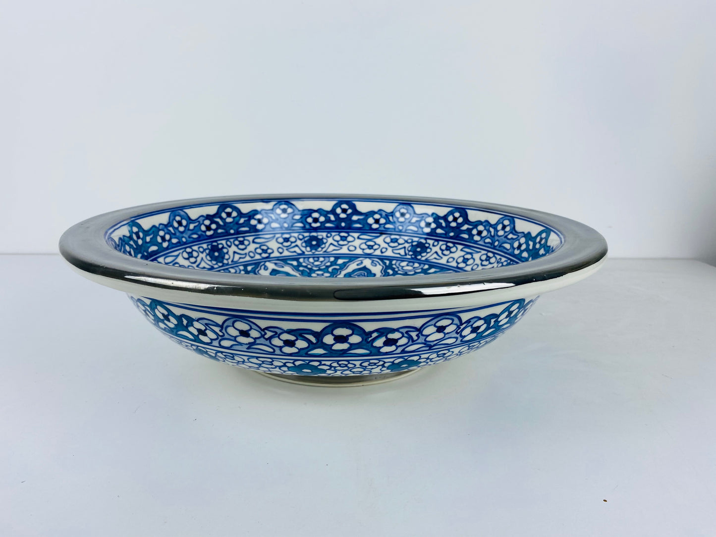 Azure Bloom Steel-Edged Vessel Sink Platinum Rim Accents