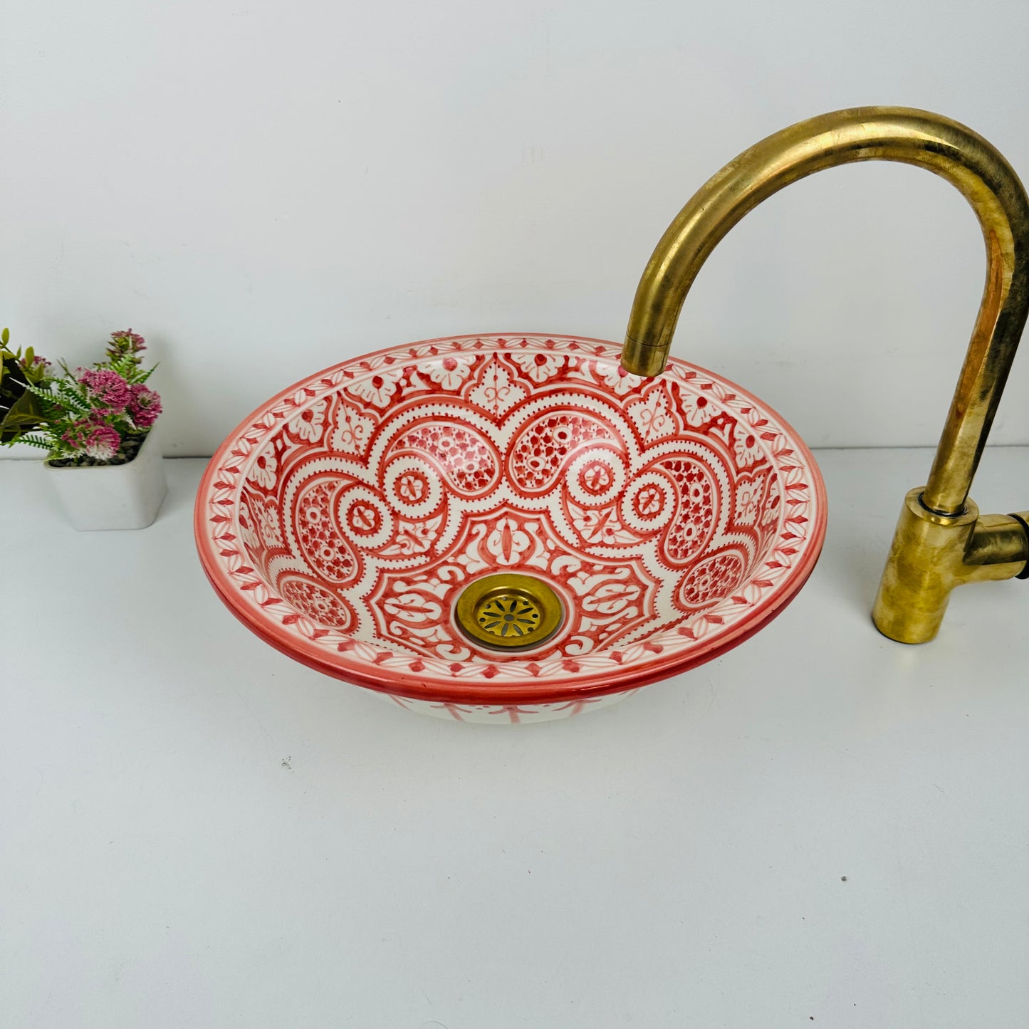 Artisan's Palette: Handcrafted Ceramic Sink with Vibrant Red Coloration