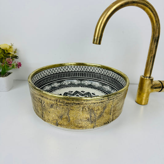 Luxury in Every Detail: Black and white Ceramic Sink with Goldish brass Embellishments