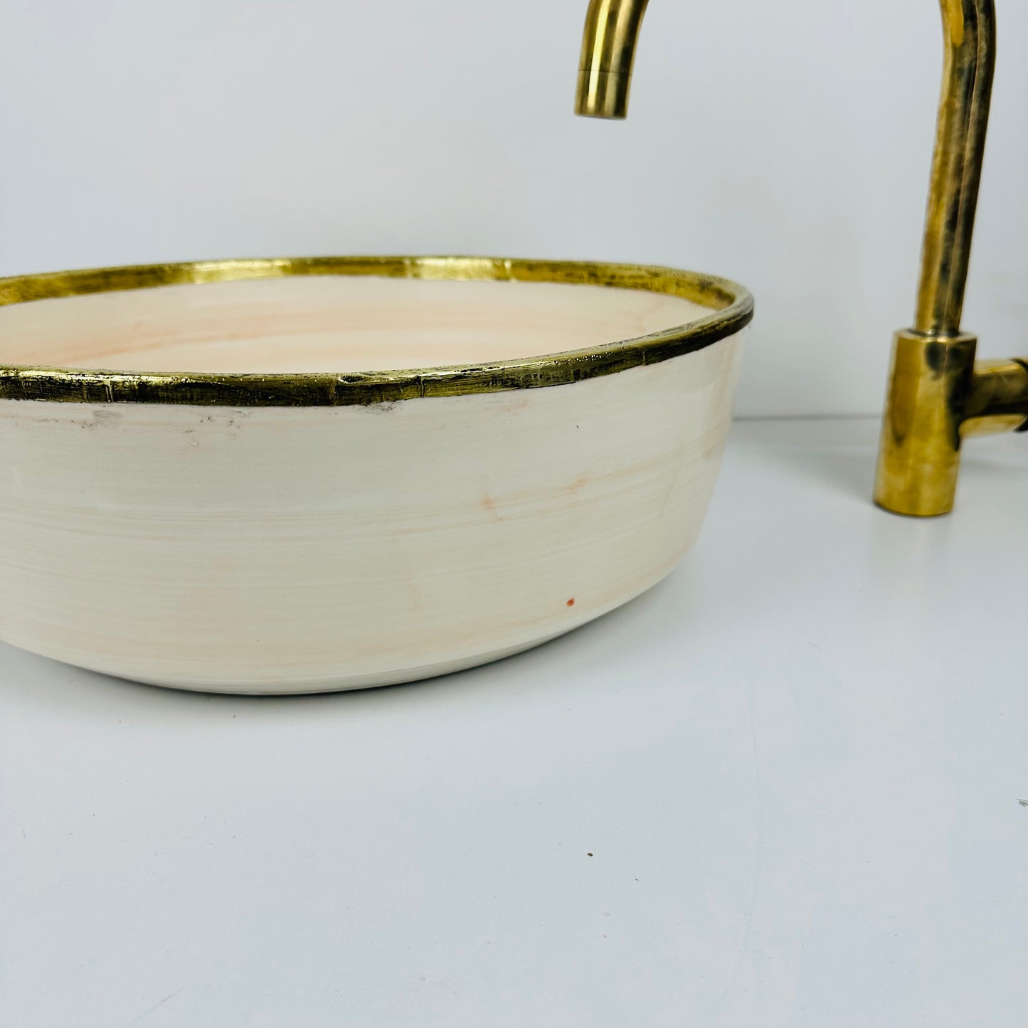 Timeless Elegance: Handcrafted Light Orange Ceramic Sink with Brass Accents