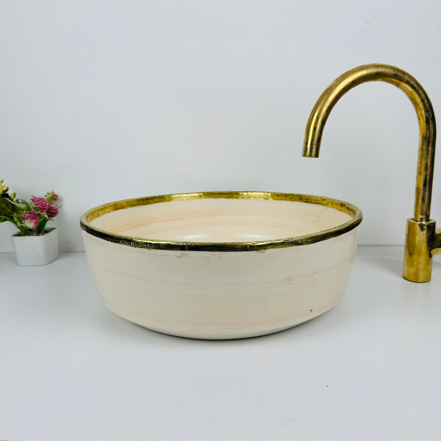 Timeless Elegance: Handcrafted Light Orange Ceramic Sink with Brass Accents