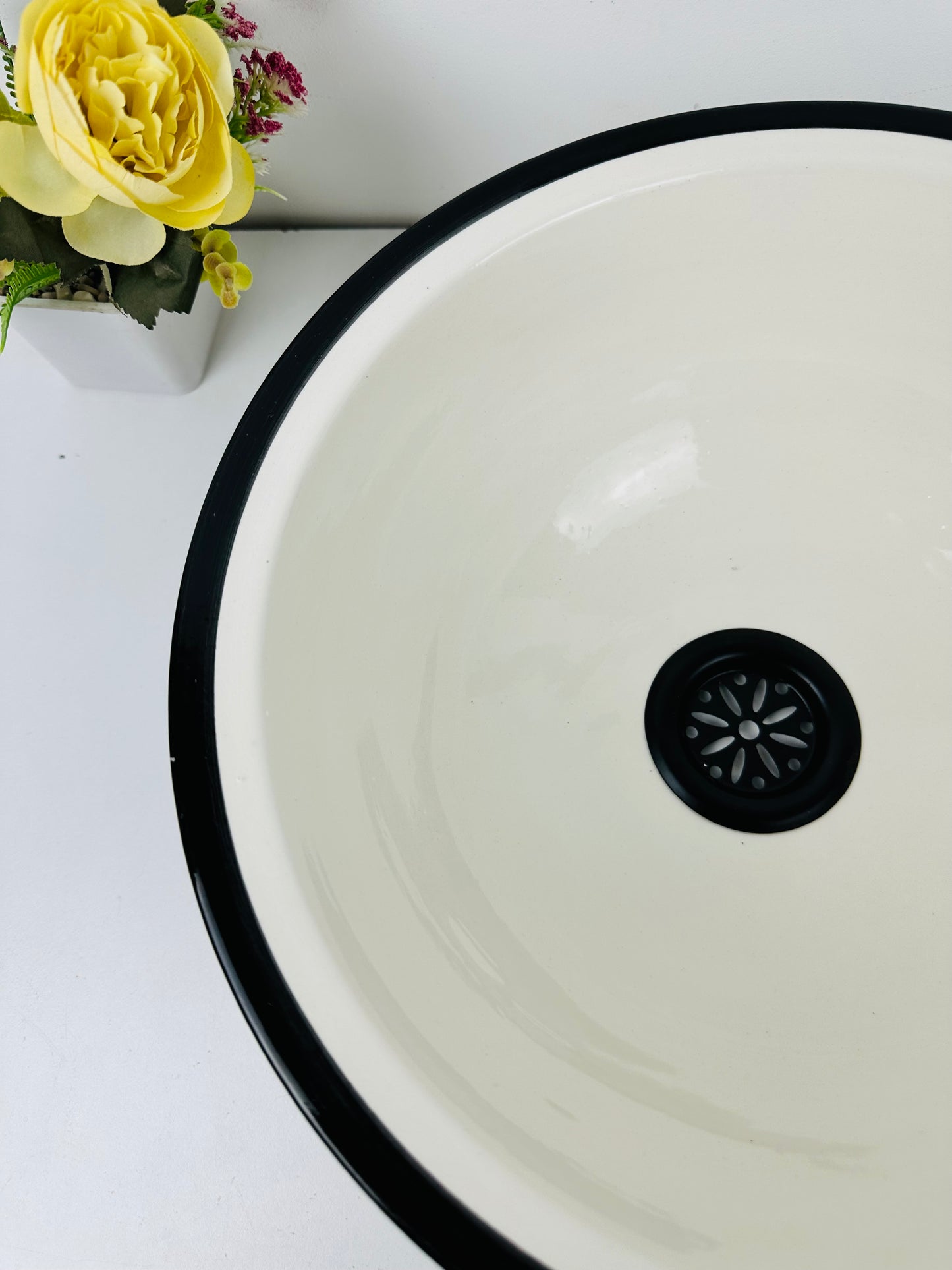 Classic Contrast: Handcrafted Ceramic Sink in Timeless Black and White Design