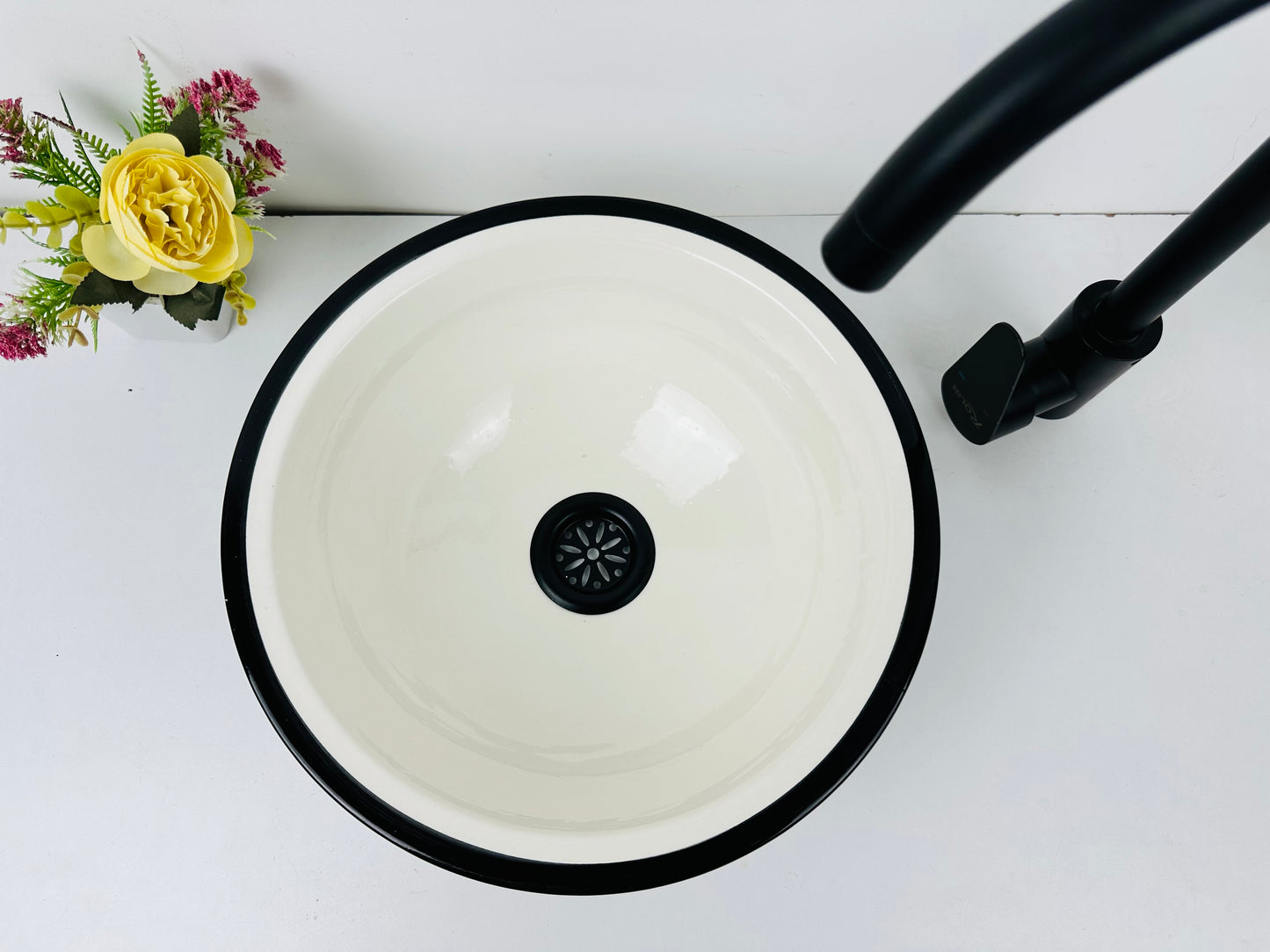 Classic Contrast: Handcrafted Ceramic Sink in Timeless Black and White Design